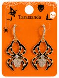 A pair of Halloween spider drop earrings displayed on an orange card. The earrings have black and gold spider body designs with rhinestone-encrusted centers and hooks.